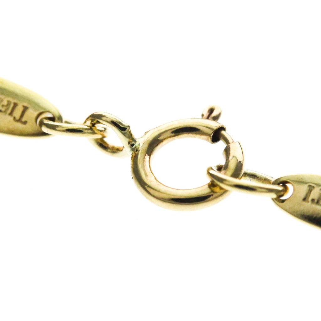 Tiffany Sebiana · 18K Yellow Gold