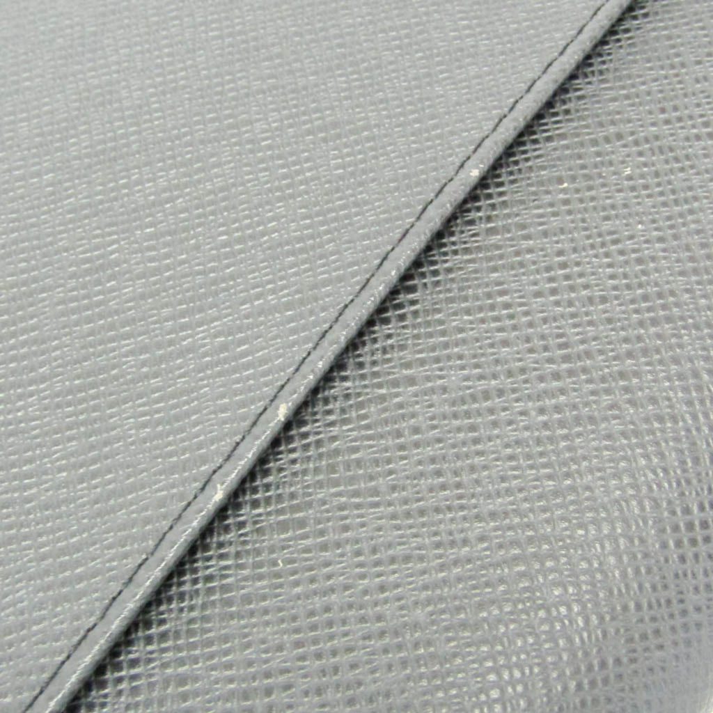 Louis Vuitton Taiga Selenga · Clutch