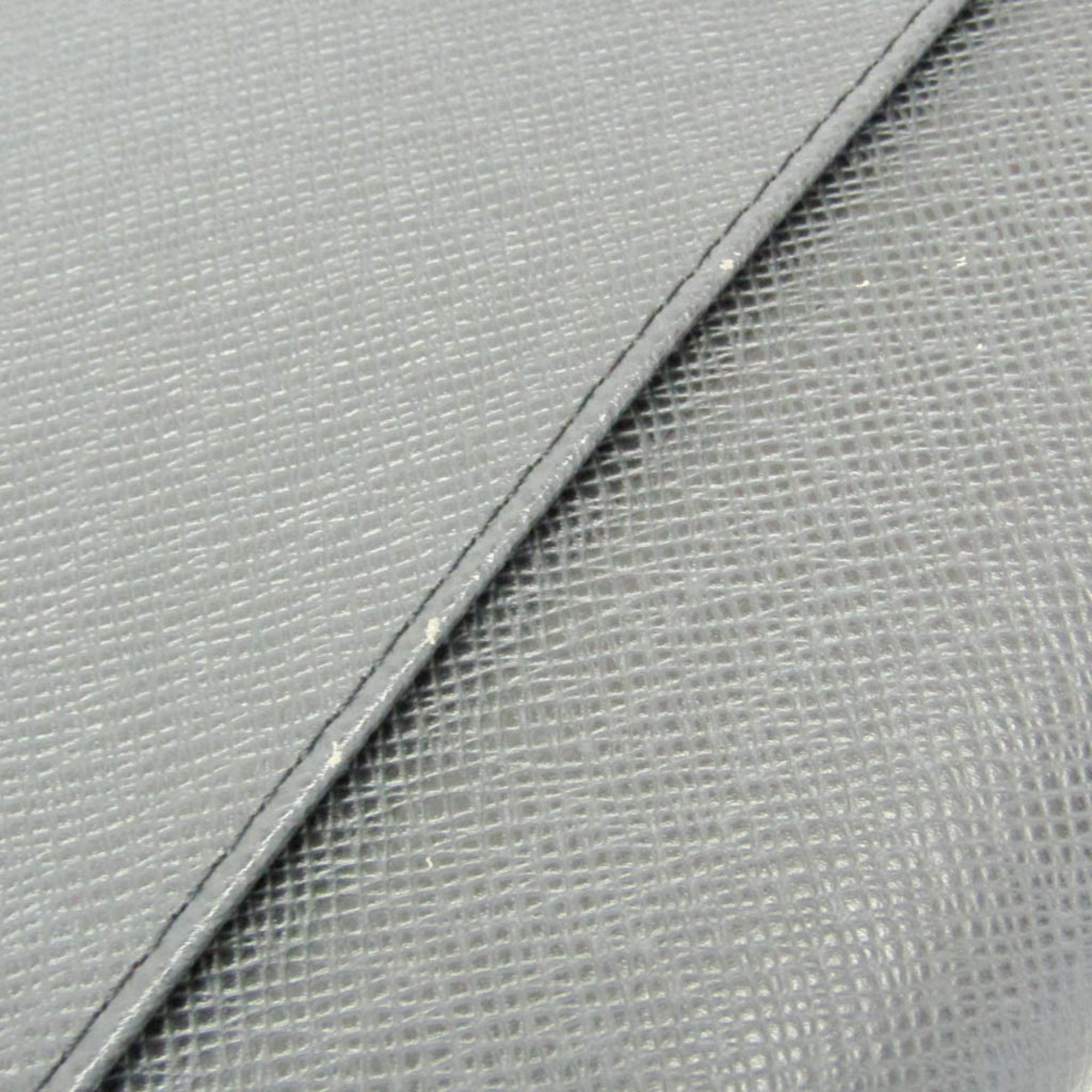 Louis Vuitton Taiga Selenga · Clutch
