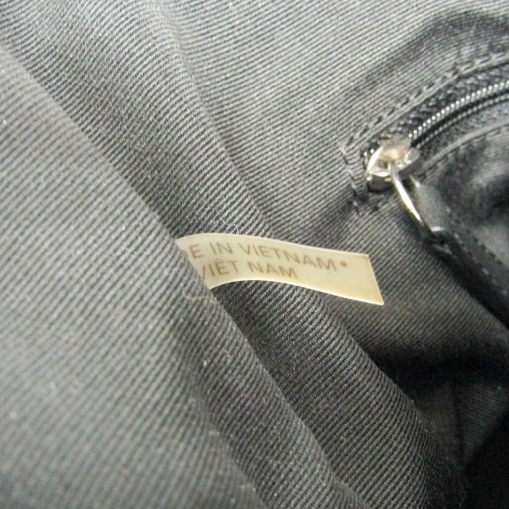 Coach Signature · Canvas & Leather