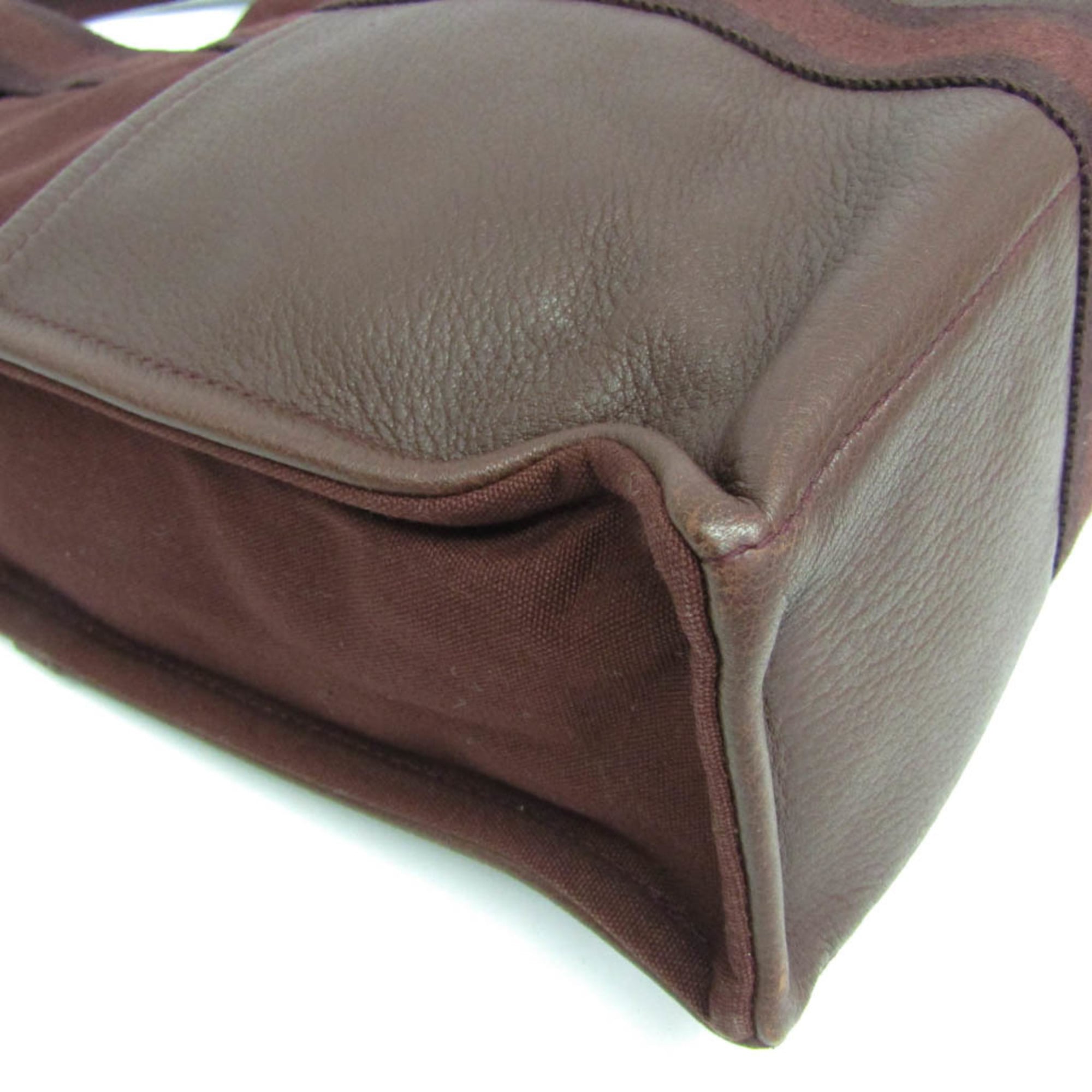 Hermès Fourre Tout MM · Canvas & Leather