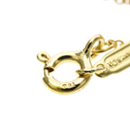 Tiffany Cross · 18K Yellow Gold · Diamond