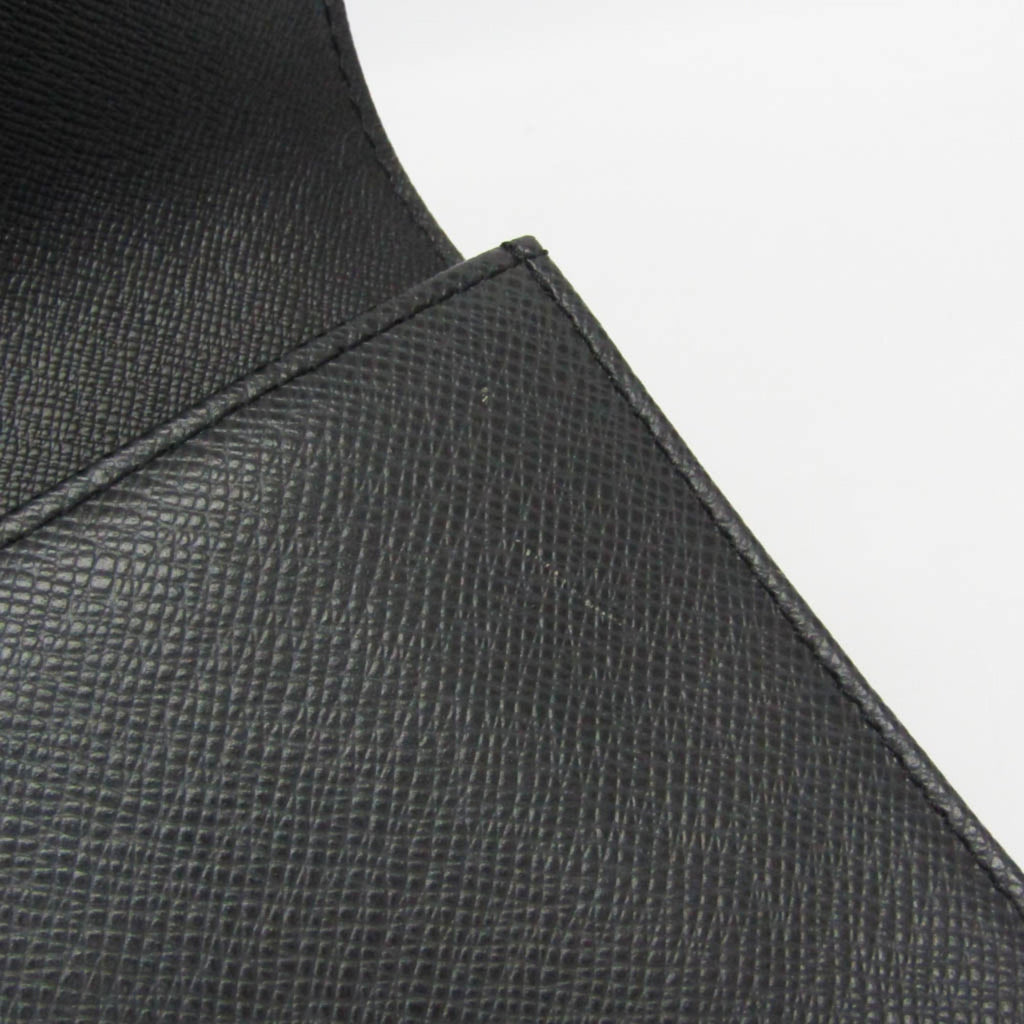 Louis Vuitton Taiga Selenga · Clutch