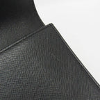 Louis Vuitton Taiga Selenga · Clutch
