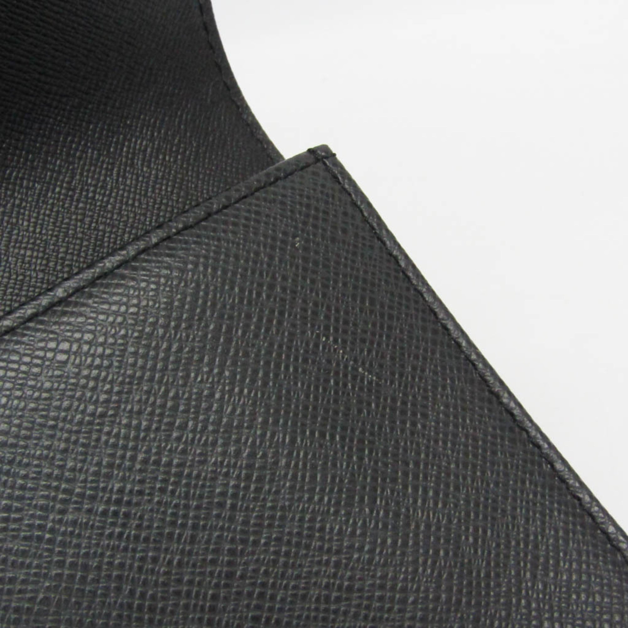 Louis Vuitton Taiga Selenga · Clutch