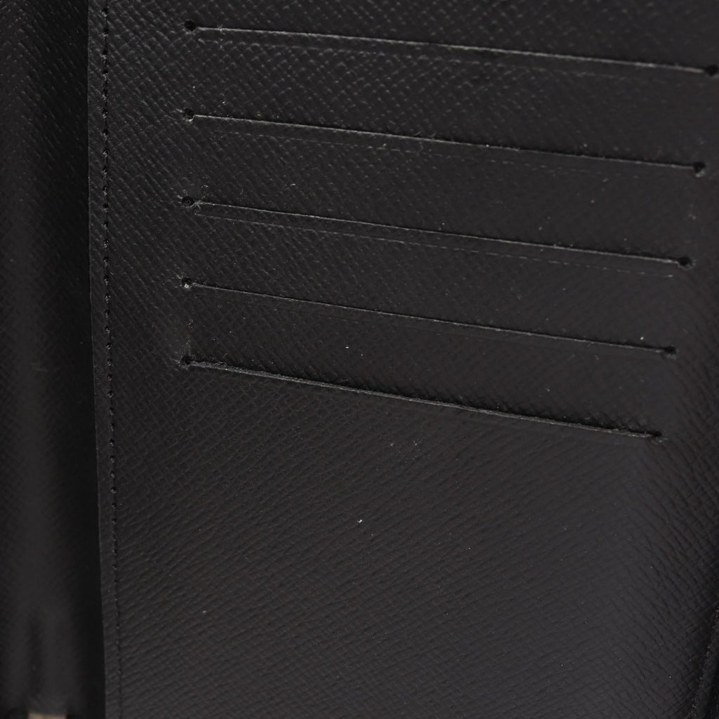 Louis Vuitton Zippy · Monogram Eclipse