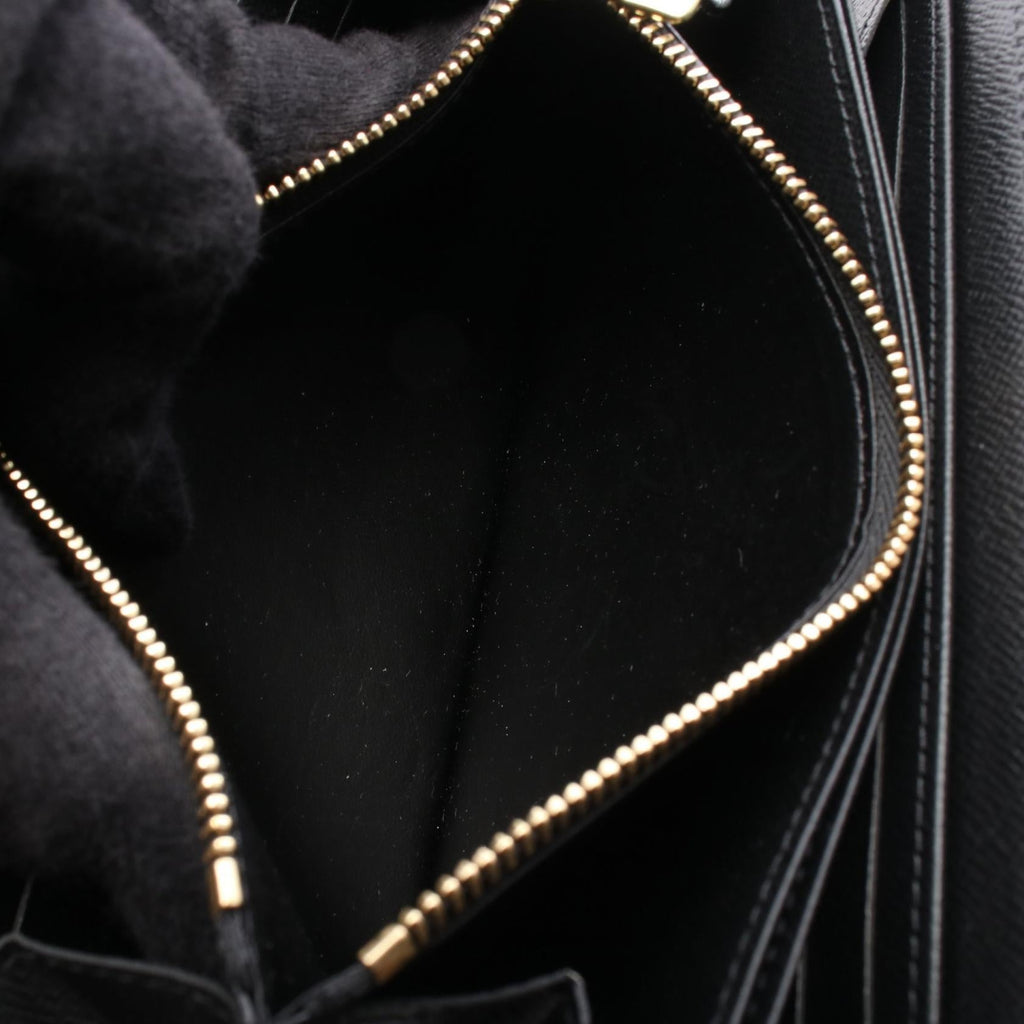 Louis Vuitton Zippy · Monogram Giant Reverse
