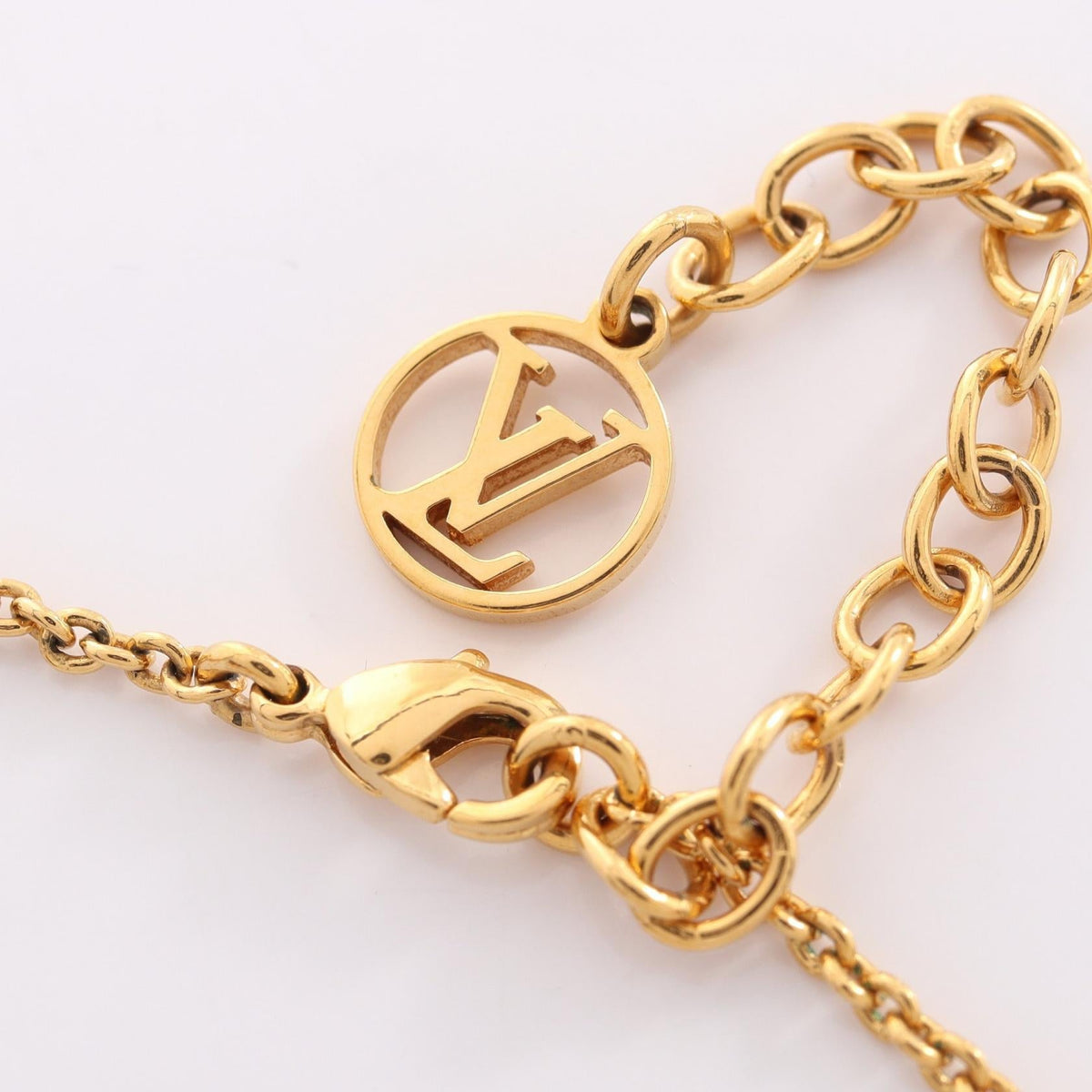 Louis Vuitton Essential V · Gold Plated