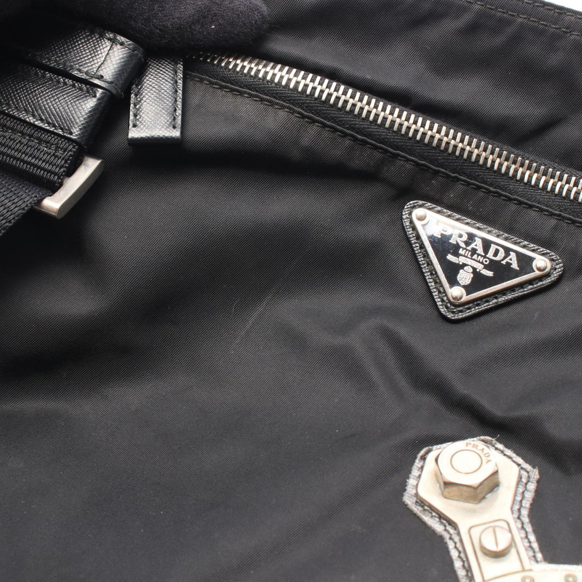 PRADA Skull Studs · Nylon Triangle Logo