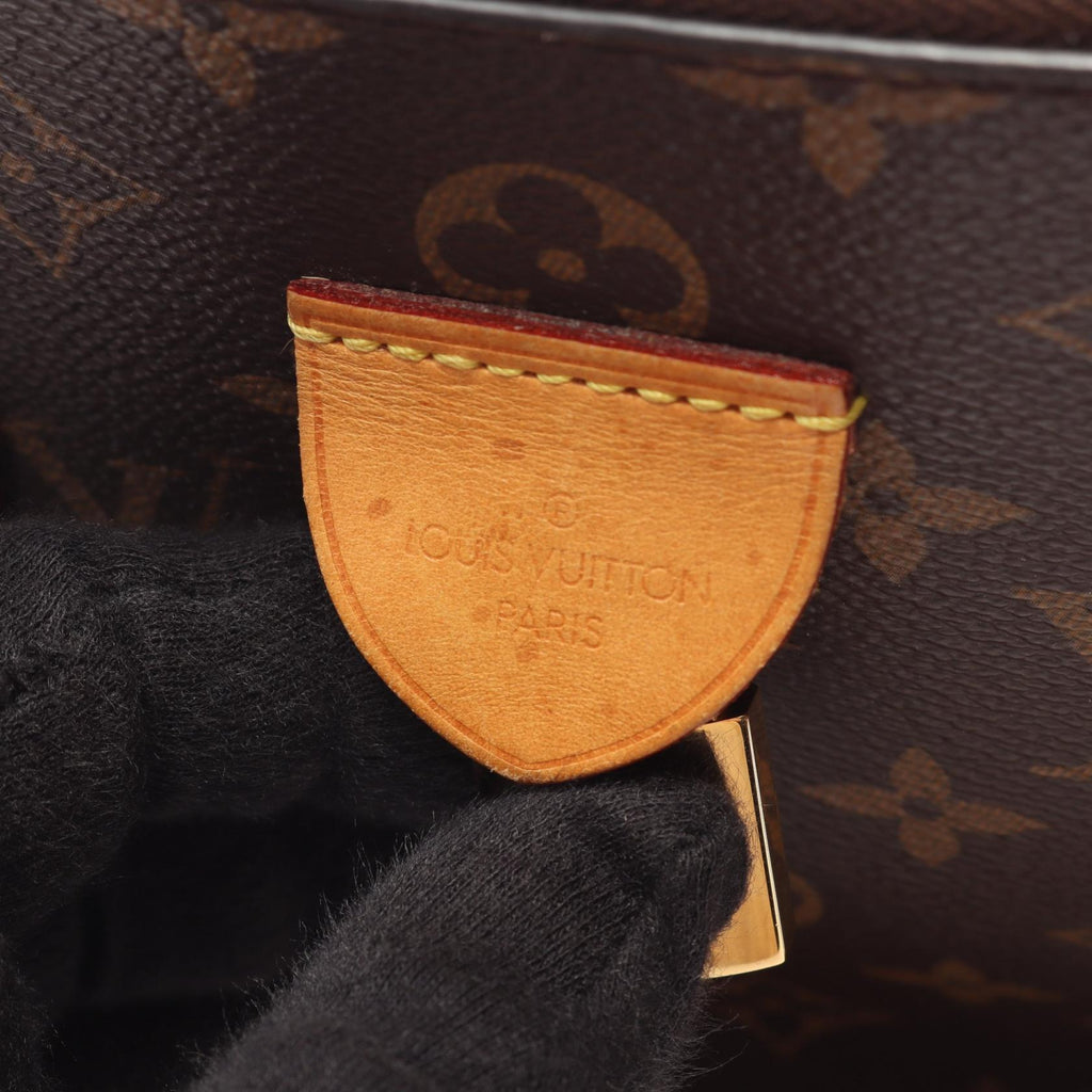 LOUIS VUITTON Rivoli MM · Monogram