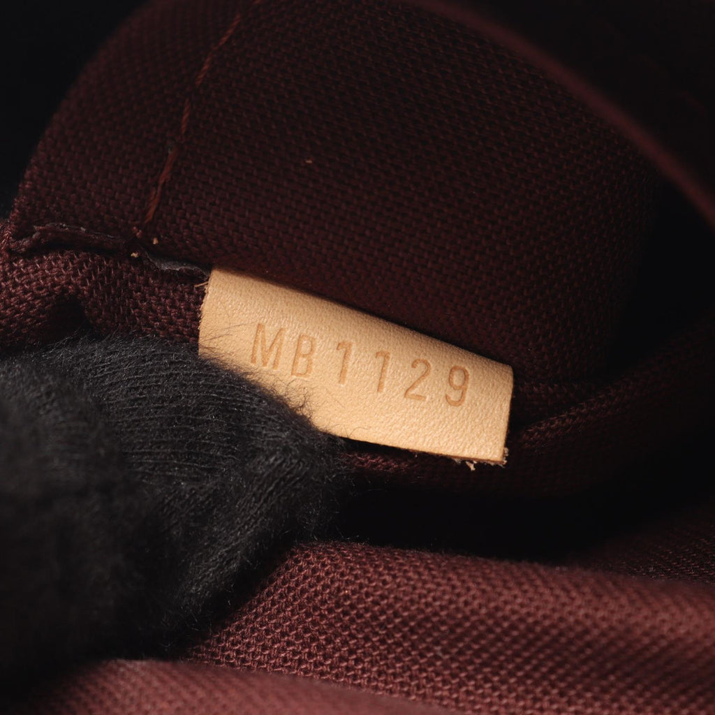 LOUIS VUITTON Rivoli MM · Monogram