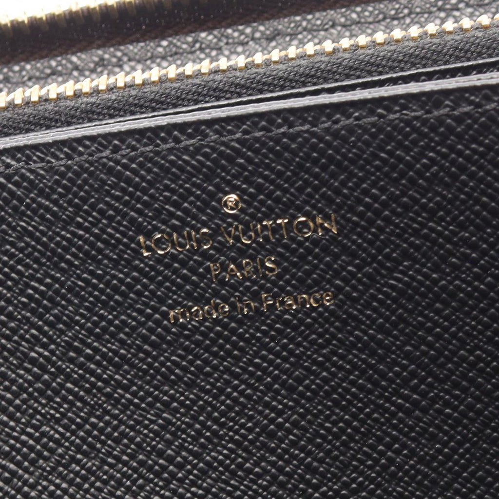 Louis Vuitton Zippy · Monogram Giant Reverse