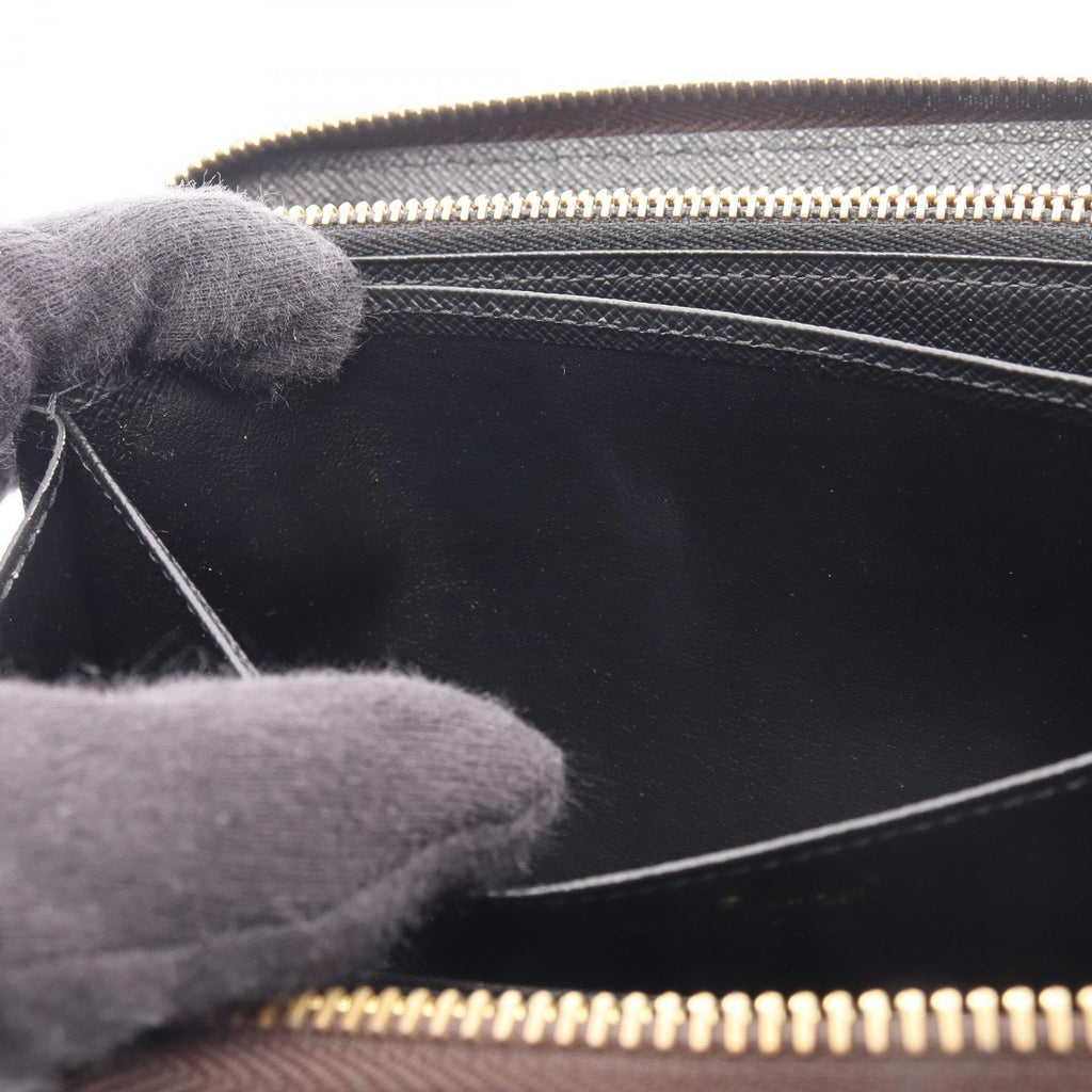 Louis Vuitton Zippy · Monogram Giant Reverse