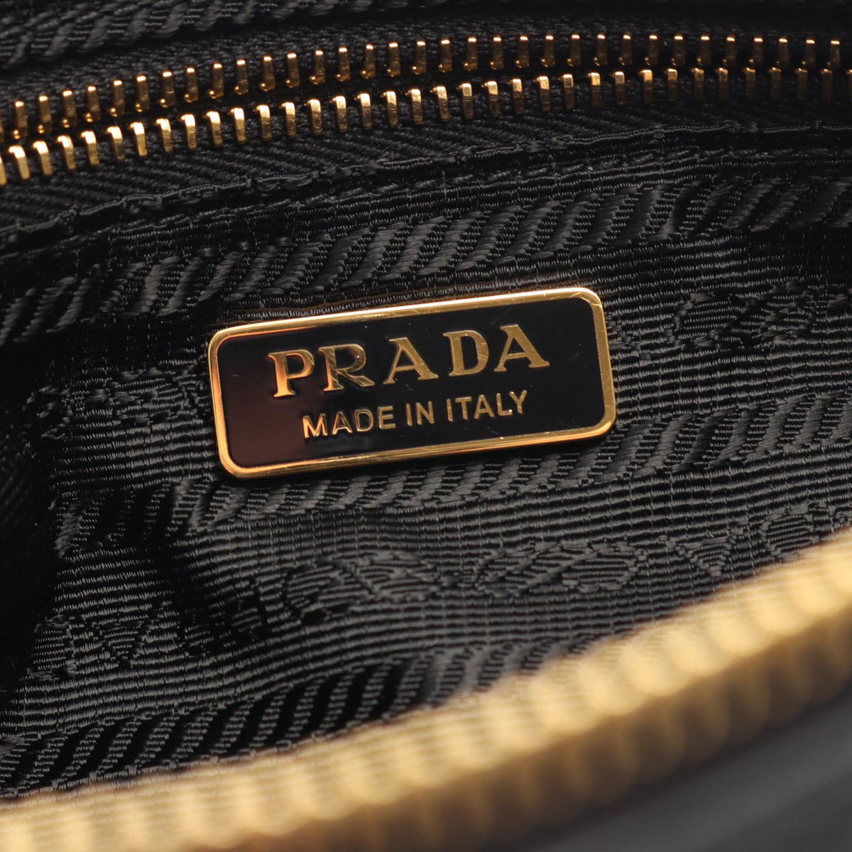 PRADA Triangular Plate Shoulder Bag · Leather