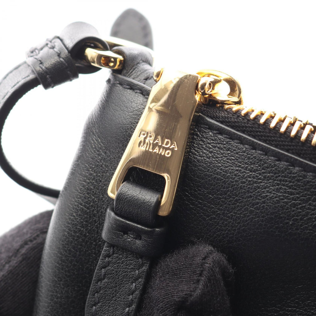 PRADA Triangular Plate Shoulder Bag · Leather