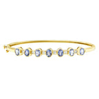 14K Yellow Gold Alternating Bezel Set 5MM Oval Shaped Tanzanite and 1/5 Cttw Diamond Bangle Bracelet (H-I Color, VS2-SI1 Clarity) - Fit's wrists up to 7.25" Inches