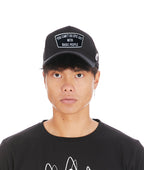 Cult's Epic Shit Mesh Back Curved Visor Trucker Hat in Black