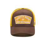 Cult's Logo Mesh Back Trucker Hat "Good At Bad Decisions" in Chocolate