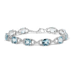 .925 Sterling Silver 7x7 mm Cushion Cut Blue Topaz and 1/20 cttw Round Cut Diamond Fashion Tennis Bracelet (I-J Color, I1-I2 Clarity) - 7"