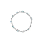 .925 Sterling Silver 7x7 mm Cushion Cut Blue Topaz and 1/20 cttw Round Cut Diamond Fashion Tennis Bracelet (I-J Color, I1-I2 Clarity) - 7"