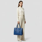 Gucci GG Embossed Tote · Leather
