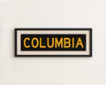 Framed Columbia Black and Gold Bus Scroll