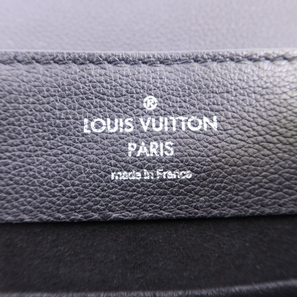 Louis Vuitton Lock Me · Calfskin Backpack