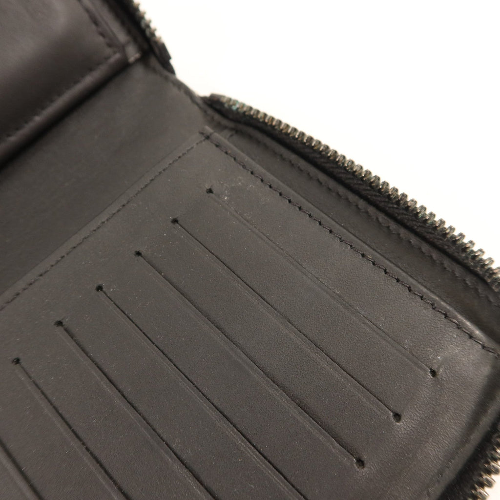 Louis Vuitton Zippy Vertical · Taurillon