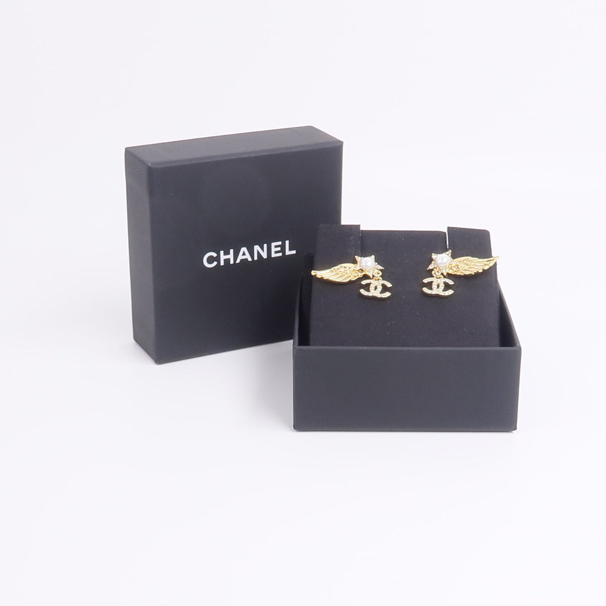 Chanel CC Wing Earrings · Gold Tone
