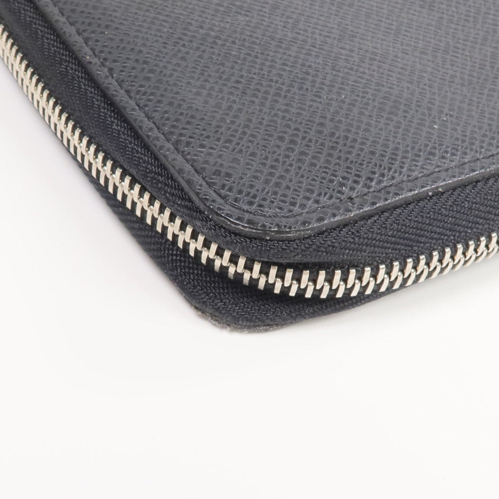 Louis Vuitton Tiga · Calfskin Zip Wallet