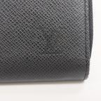 Louis Vuitton Tiga · Calfskin Zip Wallet