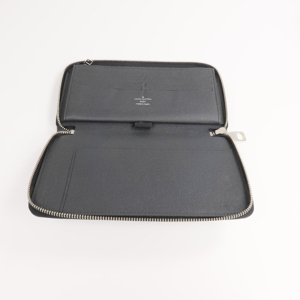 Louis Vuitton Tiga · Calfskin Zip Wallet