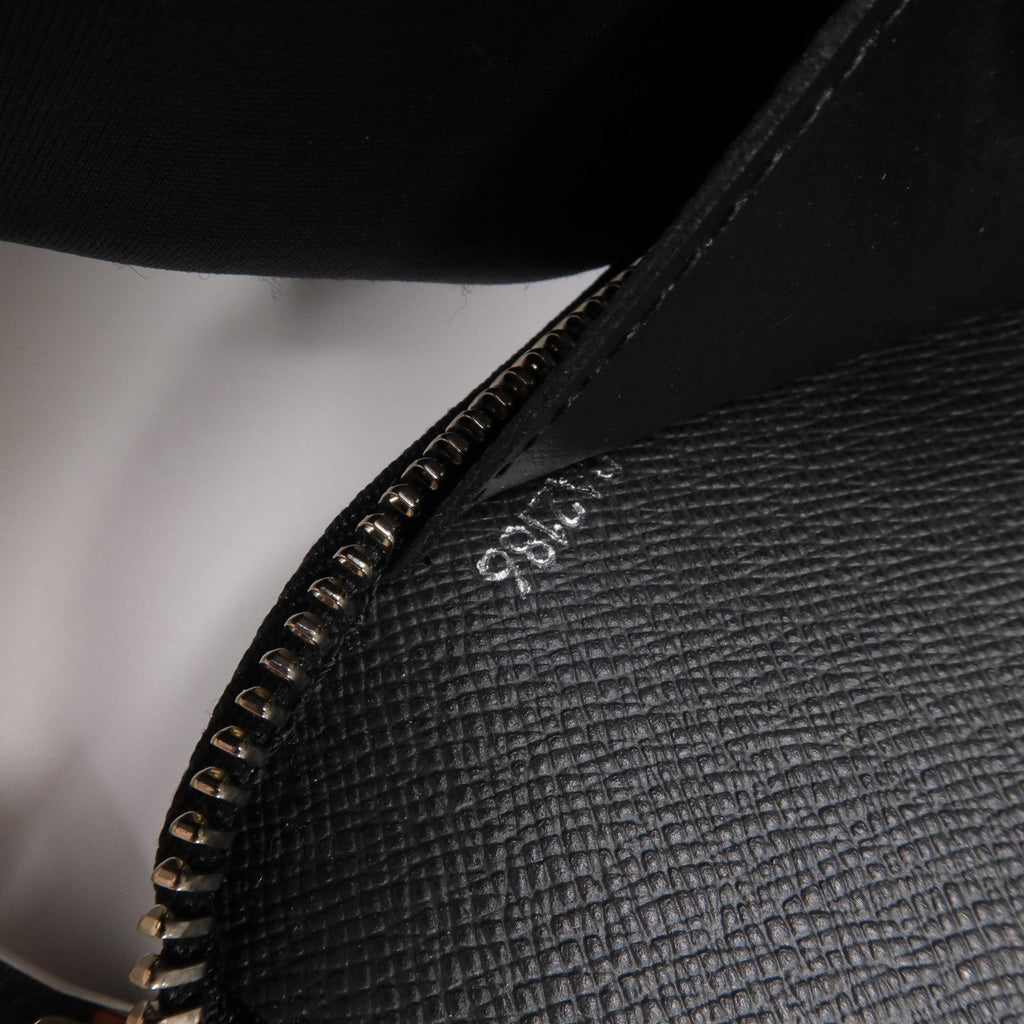 Louis Vuitton Tiga · Calfskin Zip Wallet