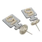 CHANEL CC Earrings · Metal