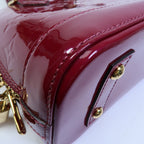 LOUIS VUITTON Alma · Vernis
