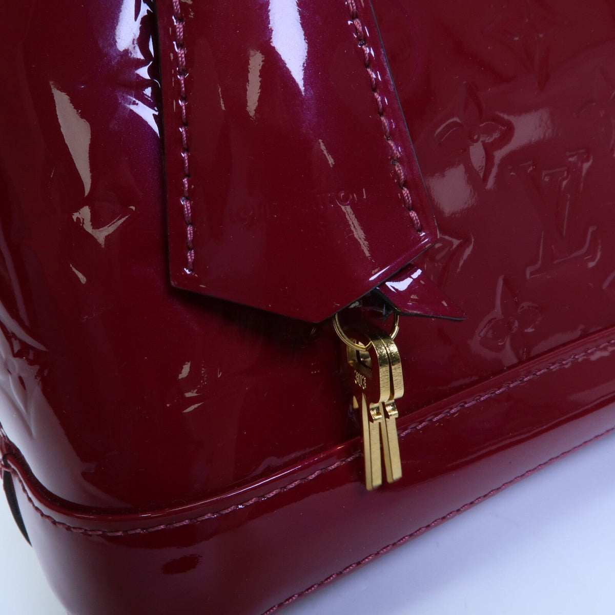 LOUIS VUITTON Alma · Vernis