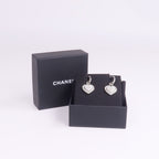 Chanel CC Earrings · Metal