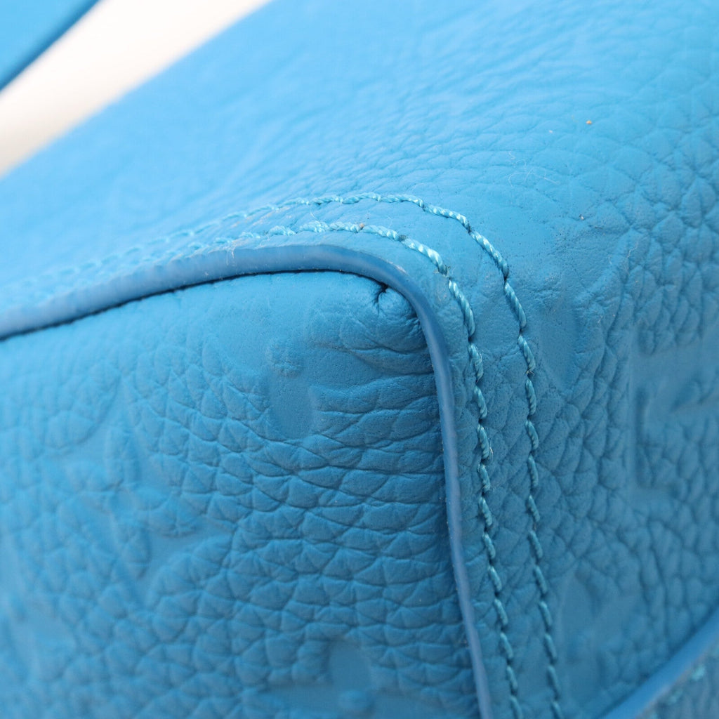 LOUIS VUITTON Triangle · Monogram Empreinte