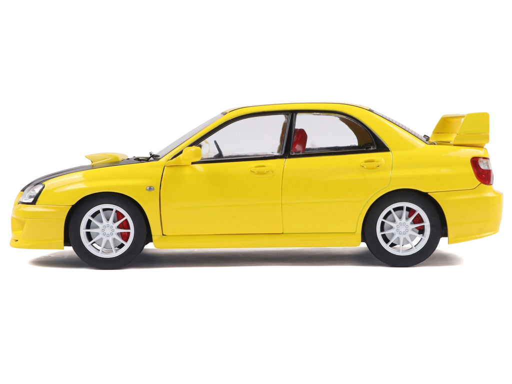 2003 Subaru Impreza WRX STI RHD (Right Hand Drive) Yellow with Carbon Hood 1/18 Diecast Model Car by Solido