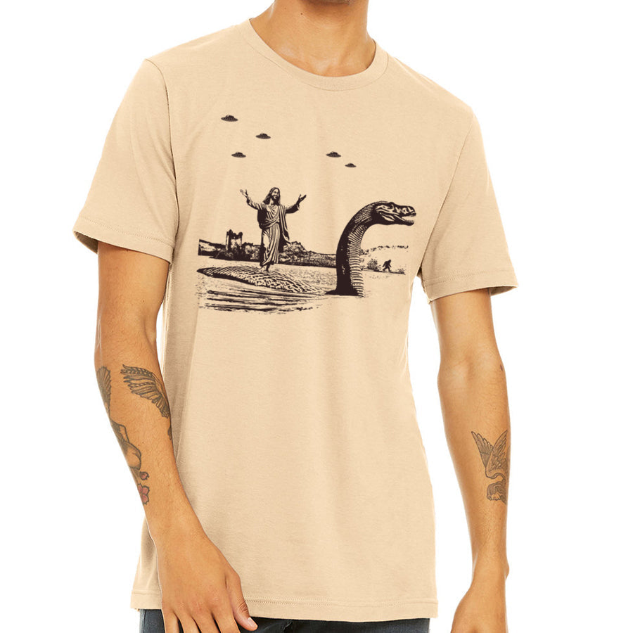 Jesus Christ Riding The Loch Ness Monster Men's Tshirt | Guys Funny Dinosaur Tee | Humorous Religious Tee with Jesus and Nessie
